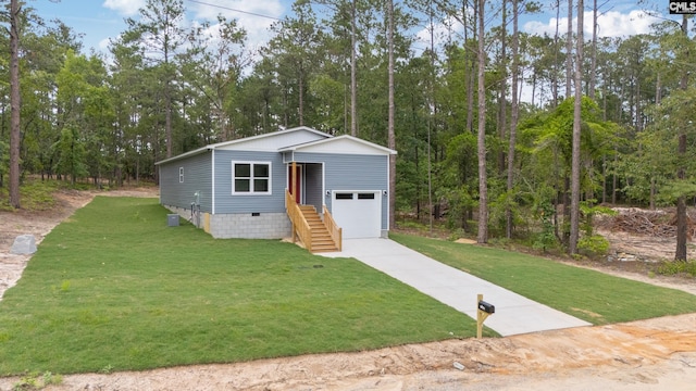 1758 Baughman Rd, Lugoff, SC 29078 - manufactured / mobile home featuring a garage, a front lawn, stairway, and driveway