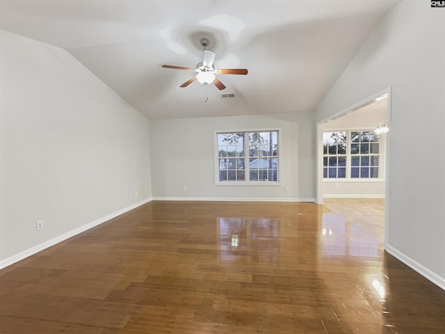 spare room featuring dark hardwood / wood-style flooring, ceiling fan, and lofted ceiling