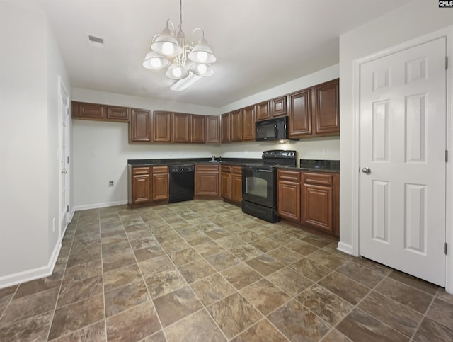 kitchen featuring a notable chandelier and black appliances