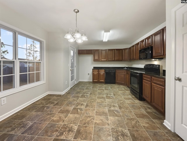 kitchen with a chandelier, decorative light fixtures, and black appliances