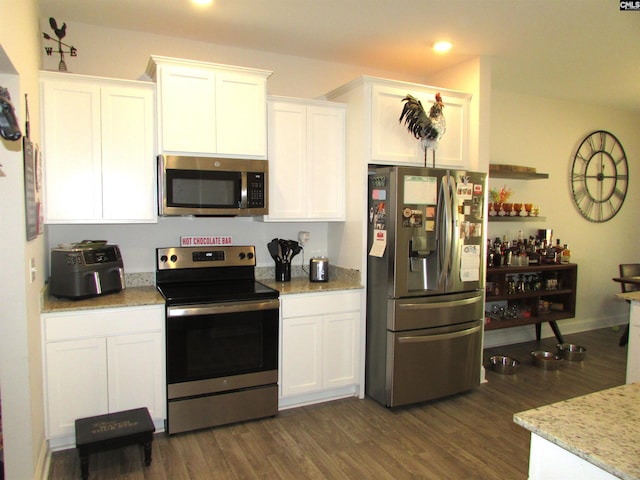 kitchen featuring white cabinetry, dark wood-type flooring, and stainless steel appliances