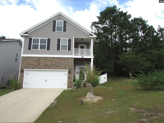 view of front of property with a balcony, a front lawn, and a garage