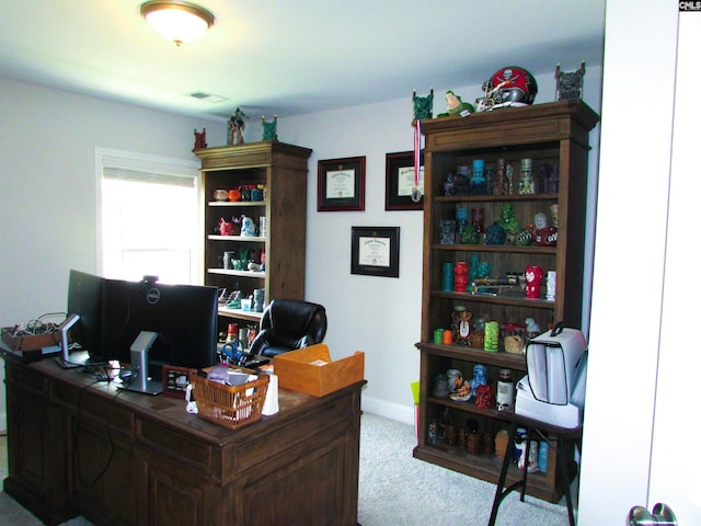 office area featuring light colored carpet