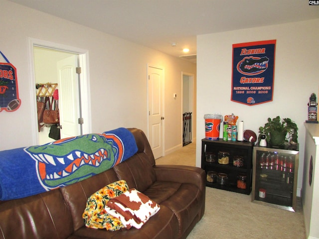 living room with wine cooler and light carpet