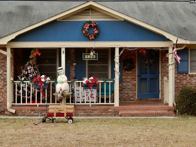 property entrance featuring covered porch