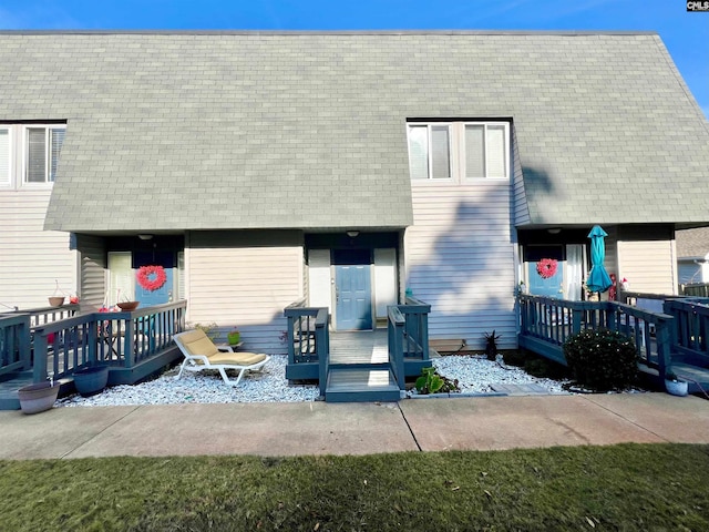 rear view of house with a wooden deck