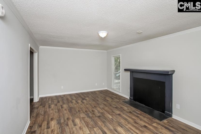 unfurnished living room featuring a textured ceiling, crown molding, and dark wood-type flooring