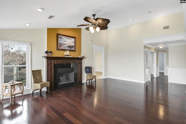 living room featuring ornamental molding, dark hardwood / wood-style flooring, ceiling fan, and lofted ceiling