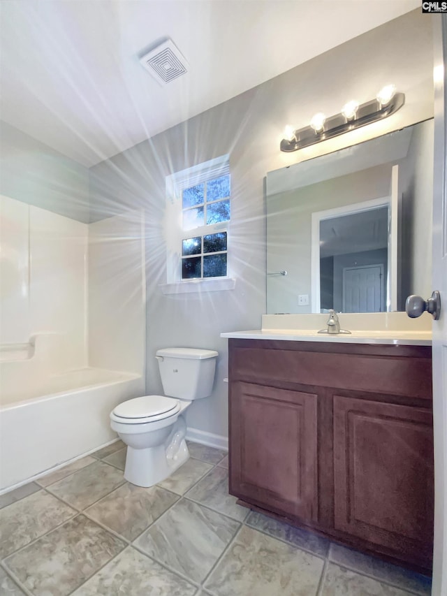 full bathroom featuring shower / bathing tub combination, vanity, and toilet