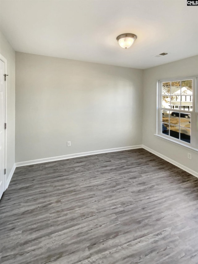 empty room featuring dark hardwood / wood-style floors