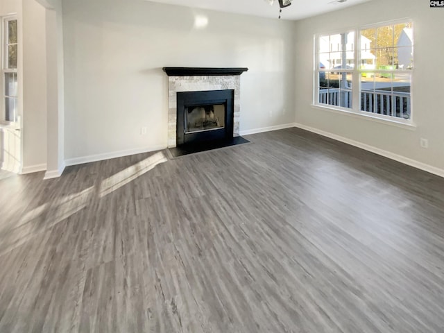 unfurnished living room with dark hardwood / wood-style flooring