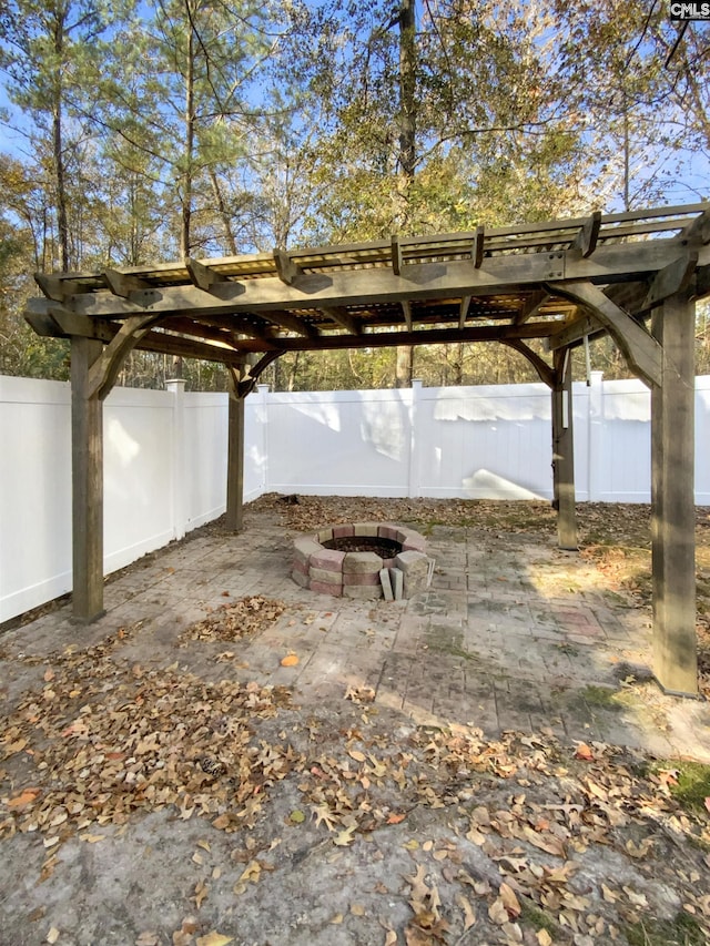 view of patio / terrace featuring a pergola and a fire pit