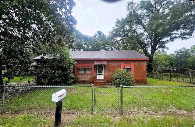 single story home featuring a fenced front yard, brick siding, crawl space, a gate, and a front yard