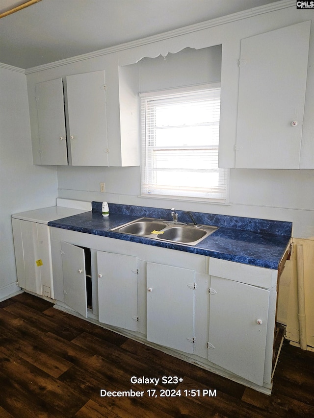 kitchen with white cabinetry, sink, and dark hardwood / wood-style floors