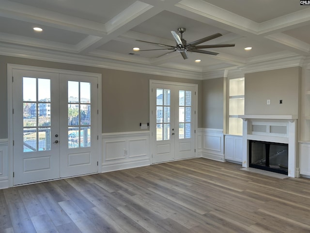 doorway to outside featuring french doors, beamed ceiling, and light wood-type flooring