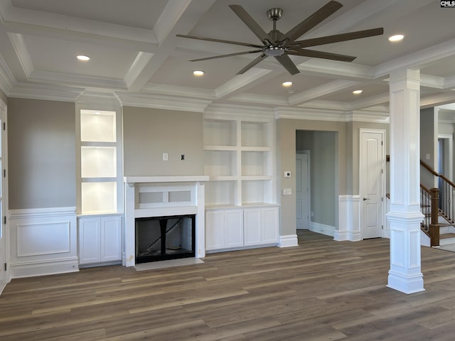 unfurnished living room with dark hardwood / wood-style flooring, decorative columns, ceiling fan, and ornamental molding