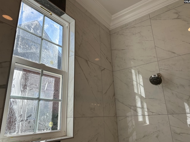 room details featuring tiled shower and ornamental molding