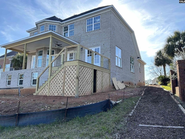 back of property featuring ceiling fan