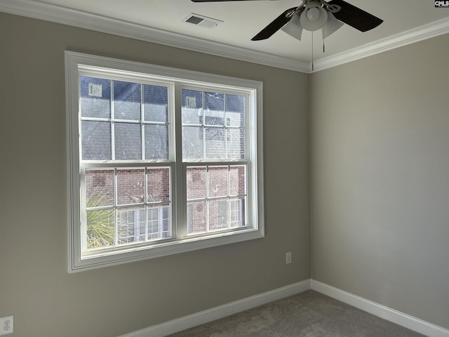 unfurnished room with ceiling fan, ornamental molding, and carpet floors