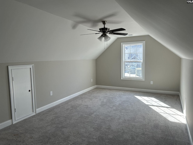 additional living space with carpet flooring, ceiling fan, and lofted ceiling