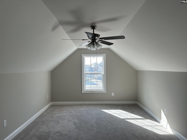 additional living space with ceiling fan, carpet, and lofted ceiling