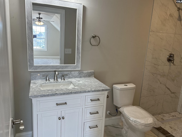 bathroom featuring tiled shower, ceiling fan, vanity, and toilet