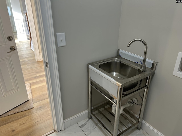 washroom featuring light hardwood / wood-style floors and sink