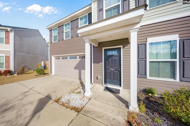 doorway to property featuring a garage