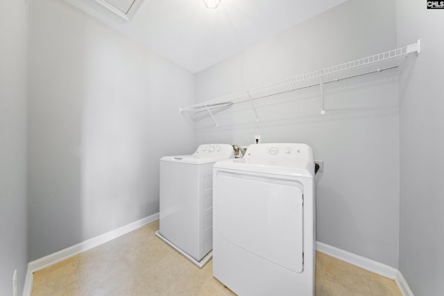 clothes washing area featuring washer and dryer