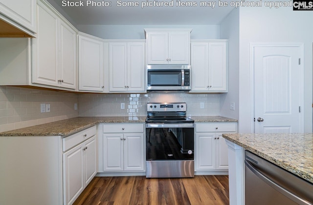 kitchen featuring white cabinets, appliances with stainless steel finishes, and dark hardwood / wood-style floors