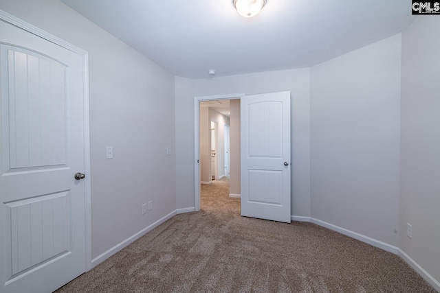 unfurnished bedroom with carpet flooring