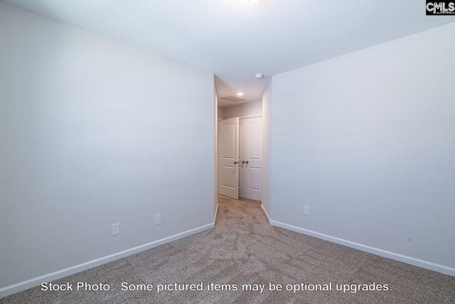 empty room with light colored carpet