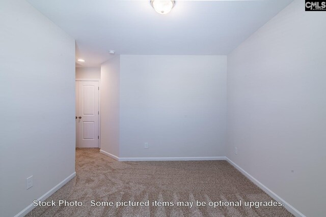 empty room featuring light carpet