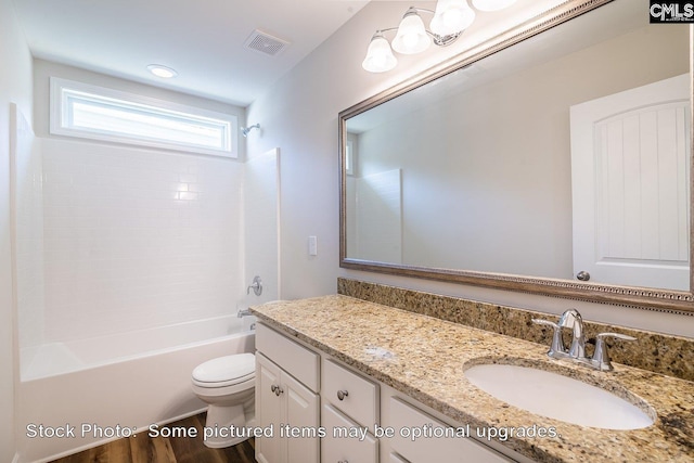 full bathroom featuring hardwood / wood-style flooring, vanity, toilet, and tub / shower combination