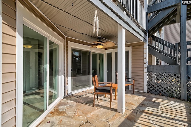 view of patio / terrace featuring ceiling fan and a balcony