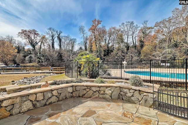 view of patio featuring a fenced in pool