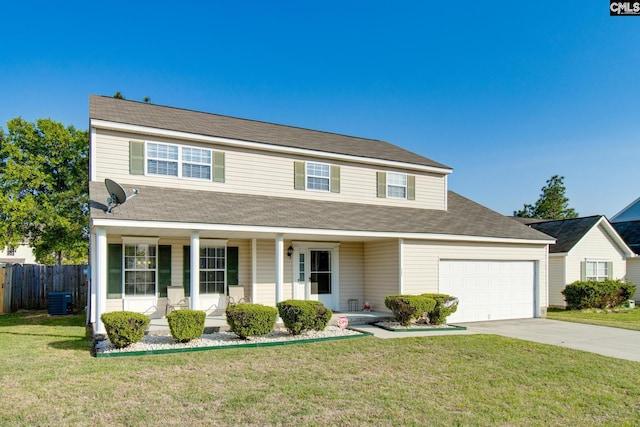 view of front of home with a front yard, central AC unit, a porch, and a garage