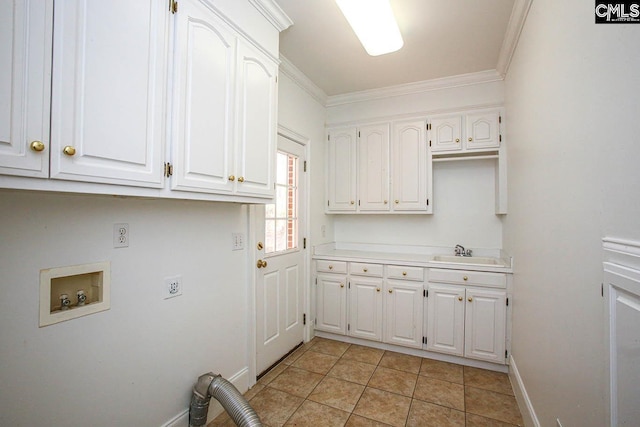 laundry area featuring sink, cabinets, washer hookup, crown molding, and light tile patterned flooring