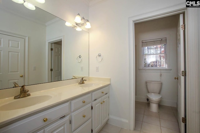 bathroom featuring crown molding, tile patterned flooring, vanity, and toilet