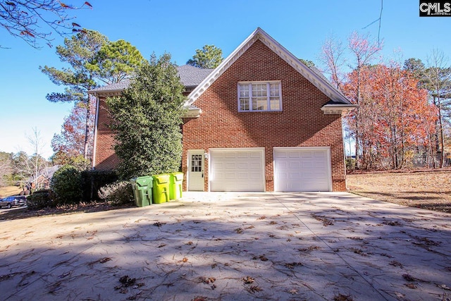 view of side of property with a garage