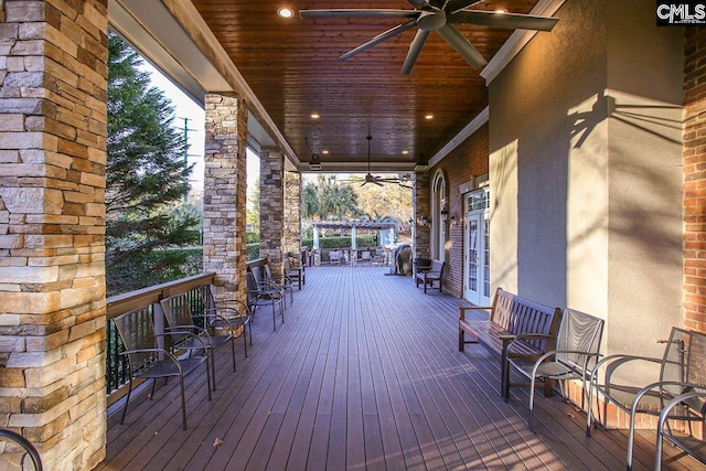 wooden terrace featuring ceiling fan