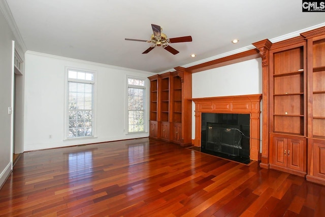 unfurnished living room with a fireplace, crown molding, dark hardwood / wood-style flooring, and ceiling fan