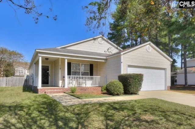 single story home featuring covered porch, a garage, and a front yard