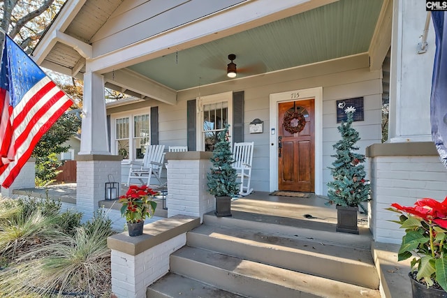 property entrance featuring a porch and ceiling fan