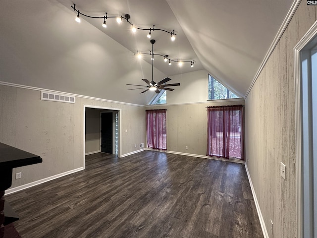 unfurnished living room featuring dark hardwood / wood-style flooring, vaulted ceiling, ornamental molding, and ceiling fan