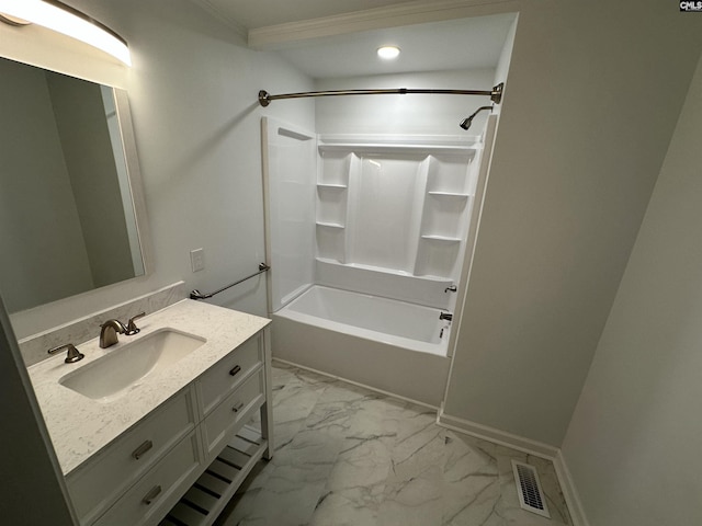 bathroom featuring vanity, washtub / shower combination, and ornamental molding