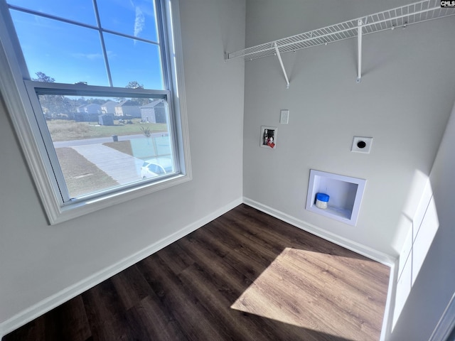 washroom with wood-type flooring, hookup for a washing machine, plenty of natural light, and electric dryer hookup