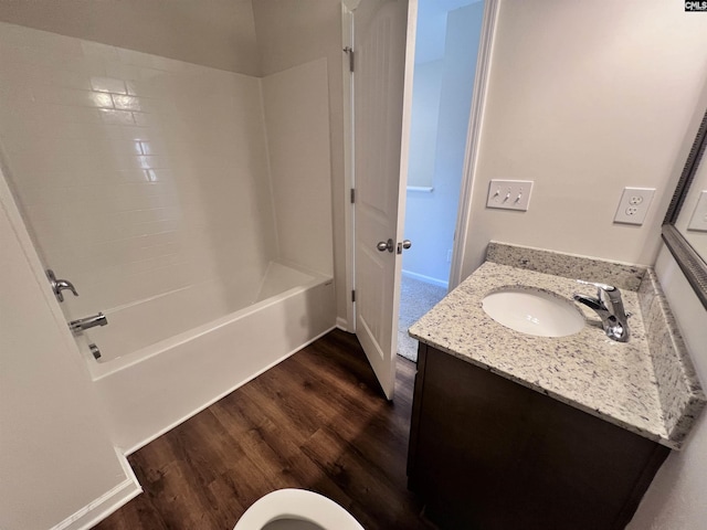 full bathroom with vanity, toilet, wood-type flooring, and shower / tub combination