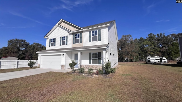 view of front of home with a garage and a front lawn