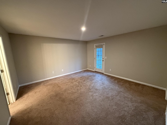 unfurnished room with carpet flooring